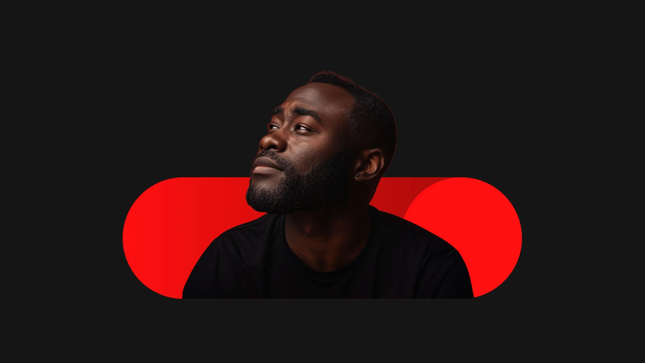 Portrait of a Black man with a short beard wearing a black shirt, looking upward and left against a dark background with red geometric shapes.
