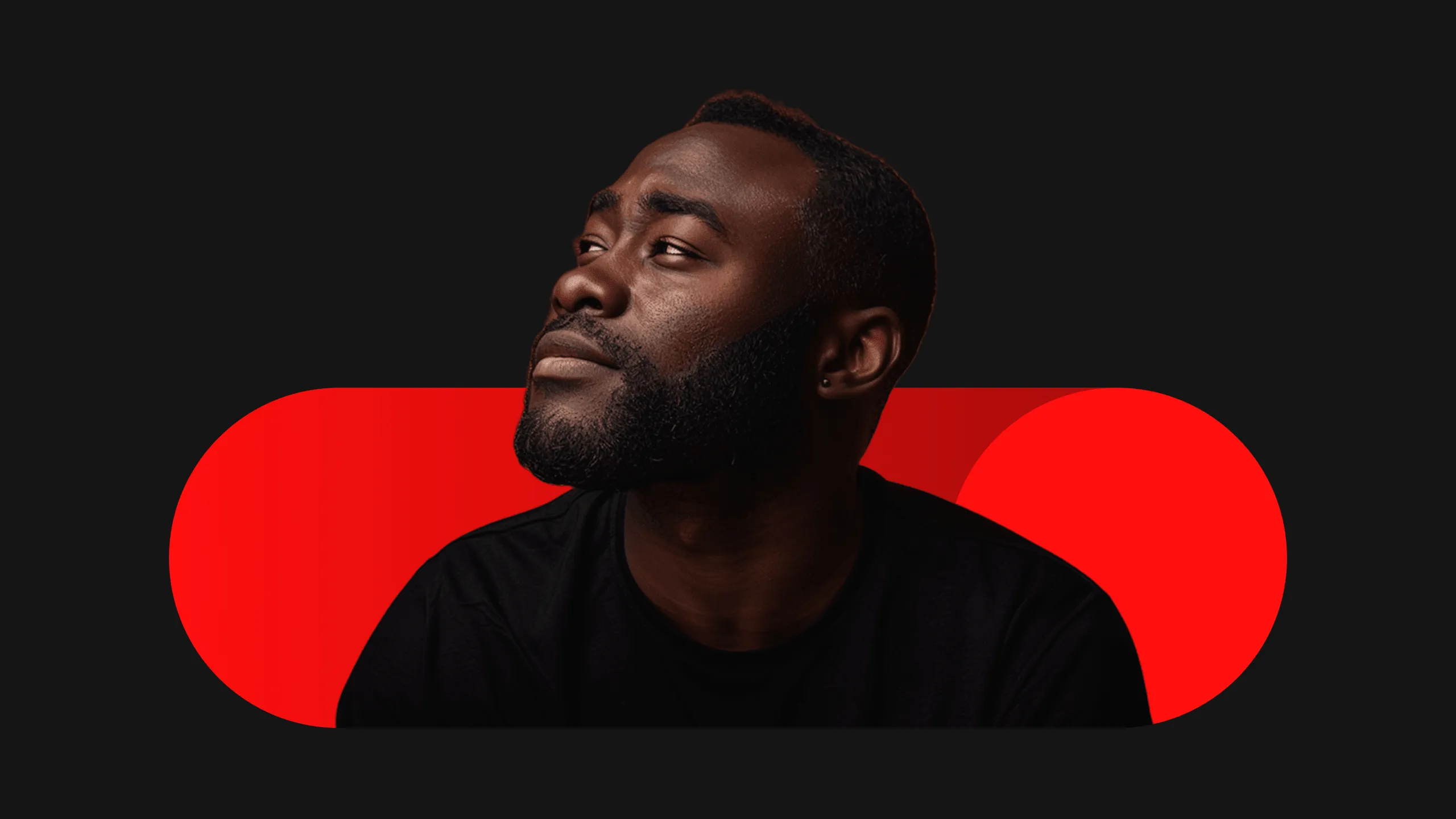 Portrait of a Black man with a short beard wearing a black shirt, looking upward and left against a dark background with red geometric shapes.