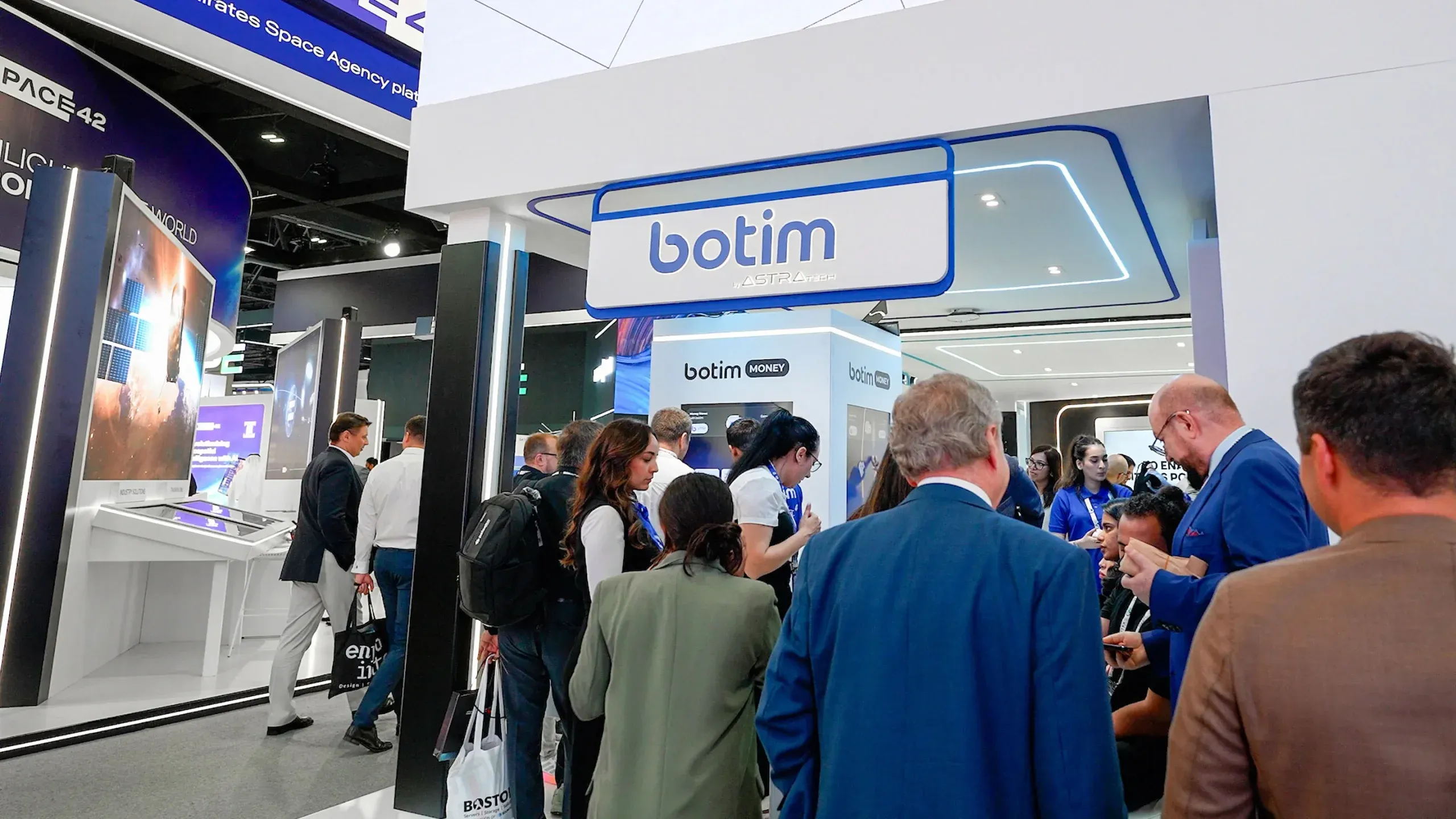 The illuminated botim booth on the GITEX show floor.