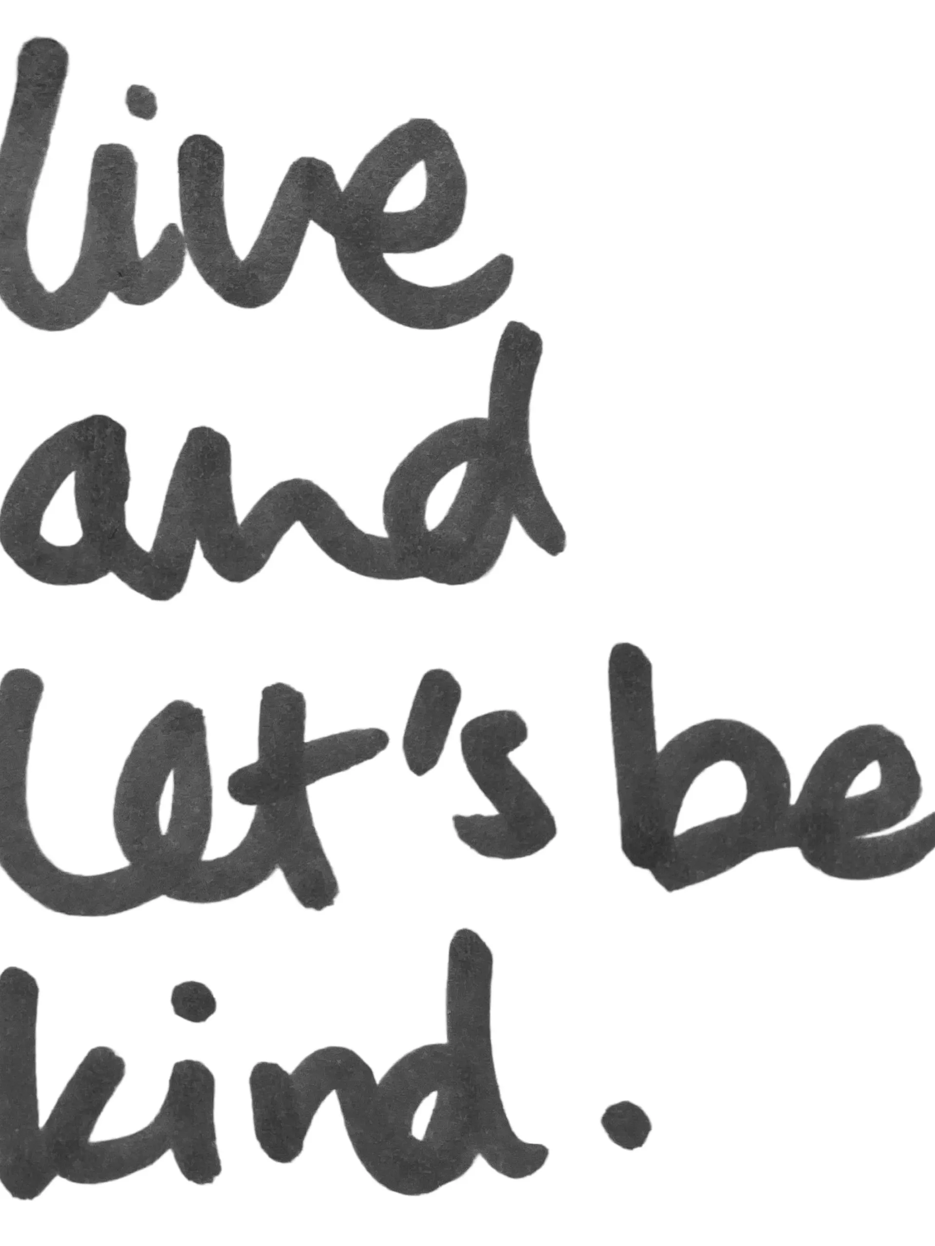 Black handwritten text on a white background reading: live and let's be kind.