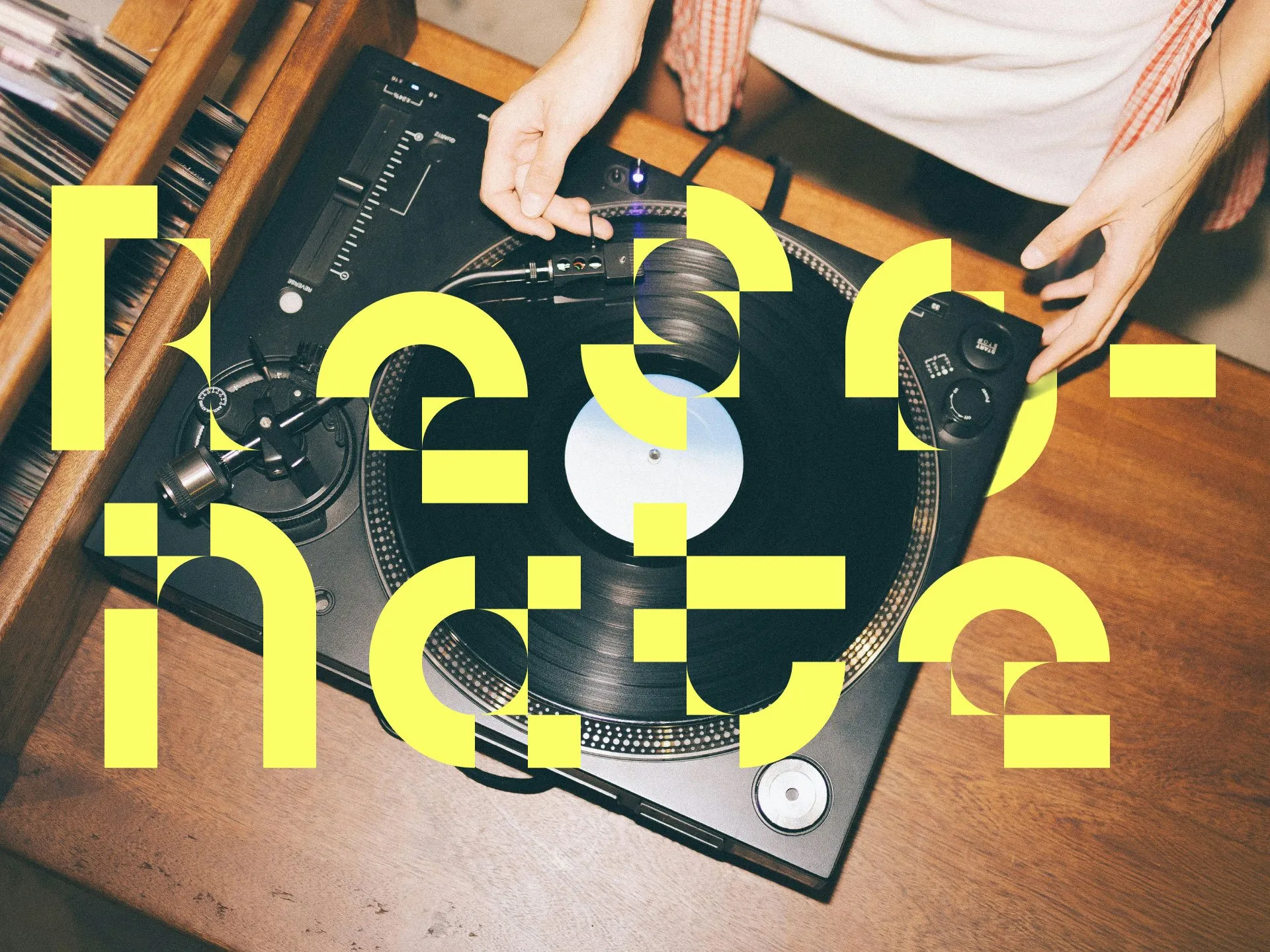 Overhead view of hands operating a vinyl record player, overlaid with large, stylized yellow typography that reads Resonance.
