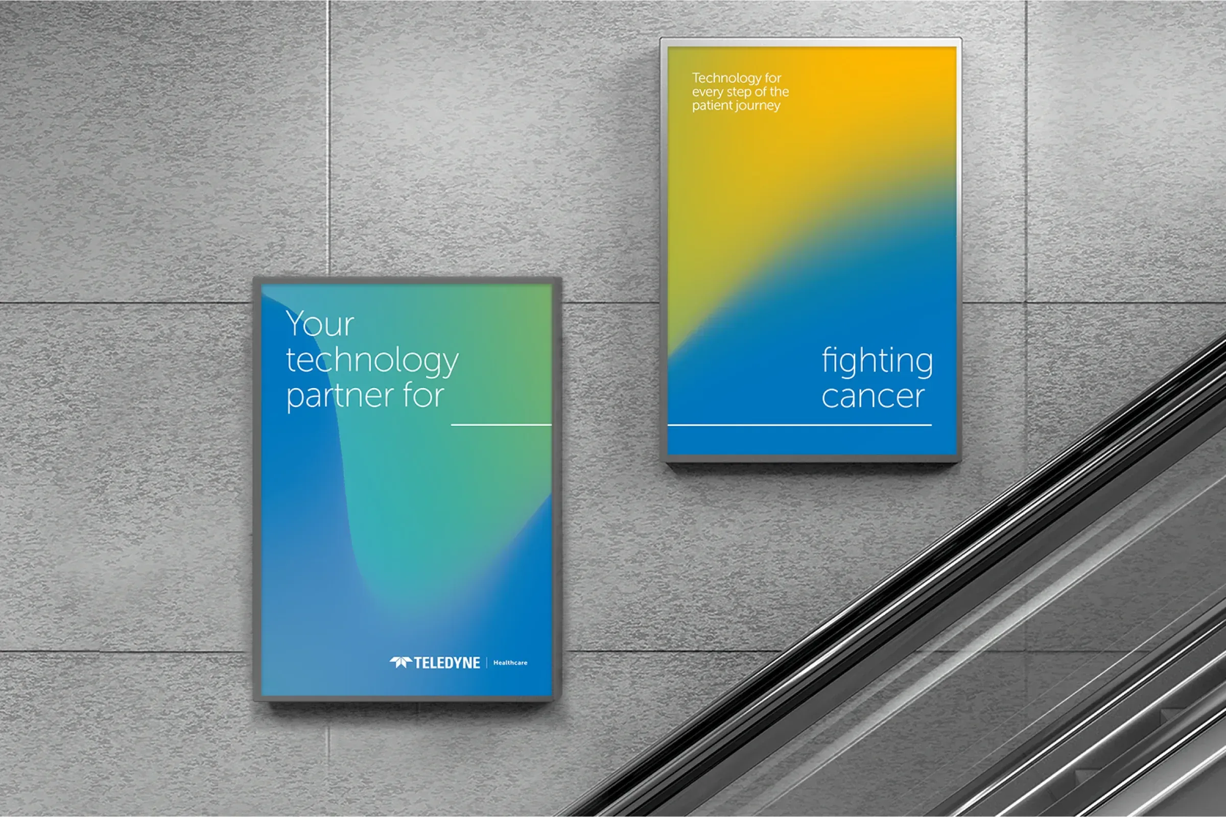 Two Teledyne Healthcare posters on a tiled wall beside an escalator, reading Your technology partner for, and fighting cancer
