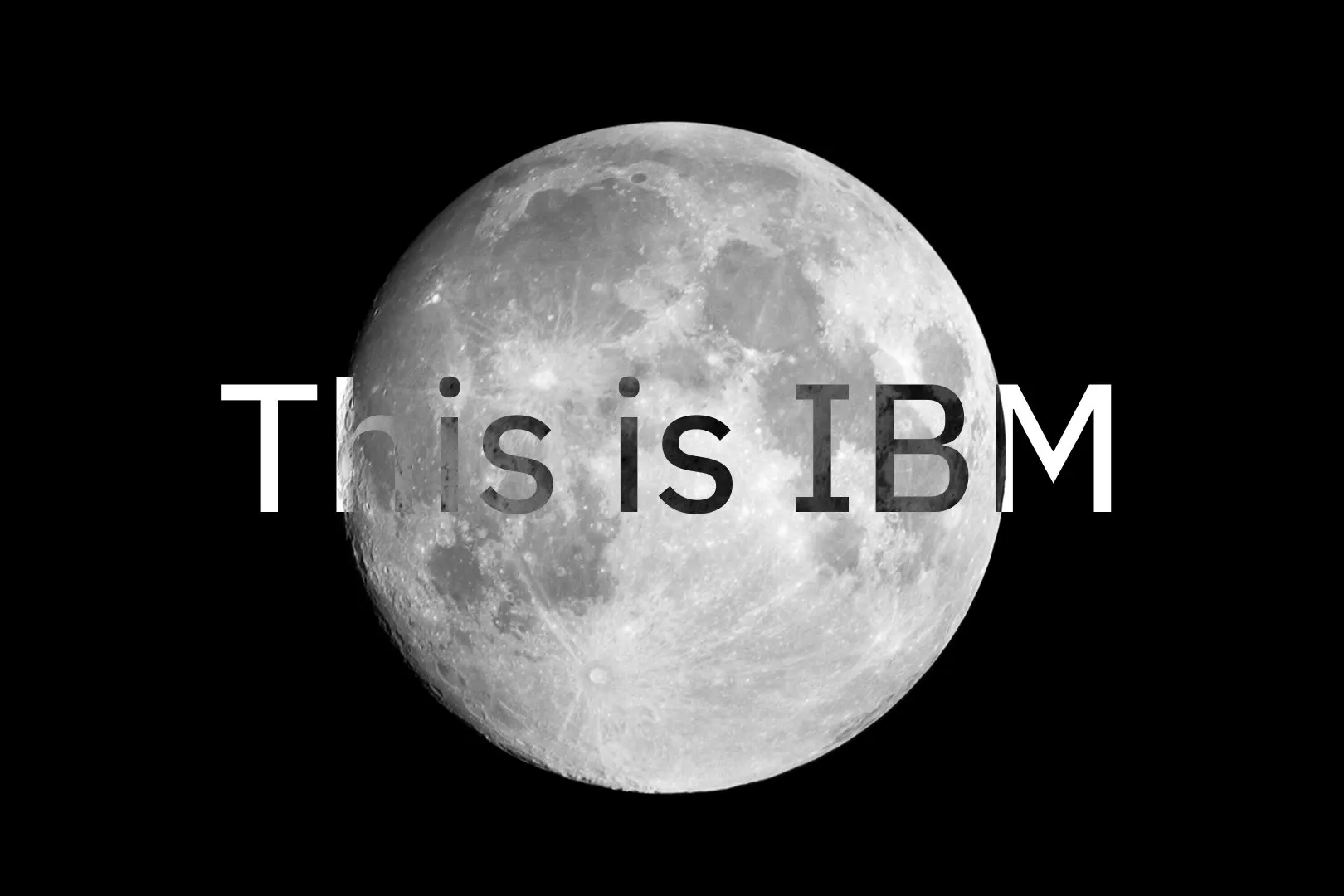 A full moon on a black background with the white text "This is IBM" across its center.